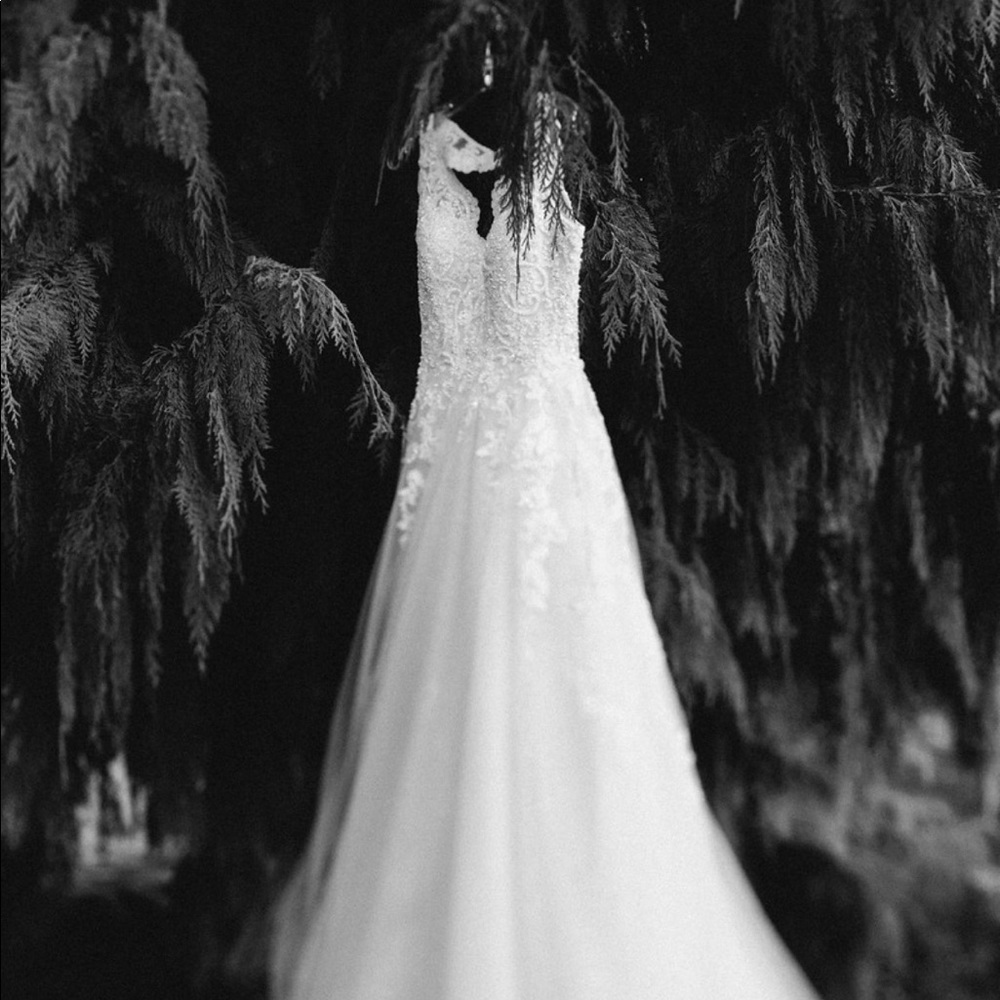 A size 6 Martina Liana Ivory wedding dress.
